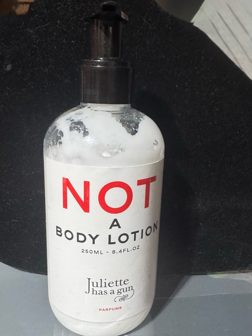 NOT A Body Lotion — White Moisturizing Body Lotion by Juliette has a gun